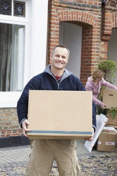Man with a van loading furniture in Tufnell Park street