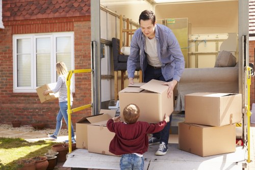 Trained movers preparing a grand piano for safe relocation in Tufnellpark
