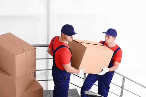Mover preparing items safely for transport with protective gear