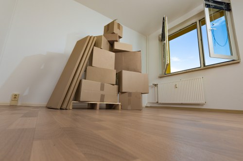 Moving team handling flat removals in Tufnellpark with boxes and furniture