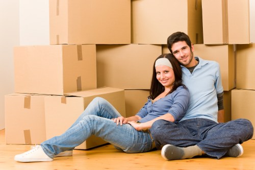 Professional movers loading furniture into a moving truck in Tufnellpark