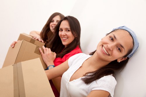 Safety-focused moving team working near a property entrance