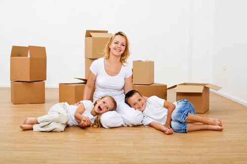 Experienced movers managing furniture removals in Tufnellpark on a narrow London street