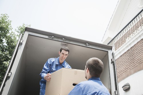 Staff managing a safe moving operation near a property