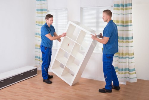 Packed boxes and furniture prepared for removal truck hire