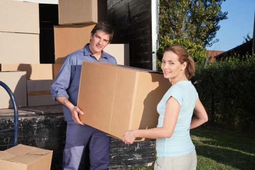 Team member checking a moving load during a house removal